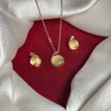 Elegant Gold Swirl Pendant Necklace Set with Yellow Stone